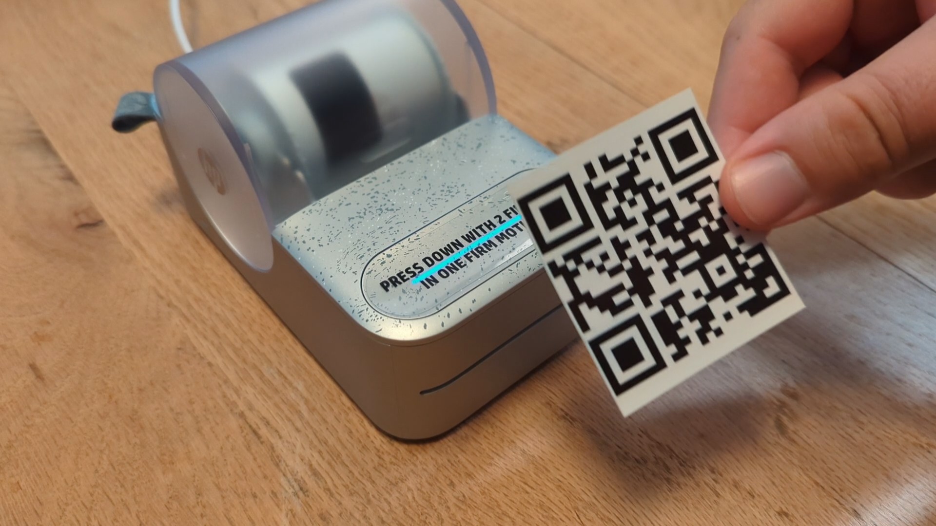 A QR Code being printed by the HP Sprocket Panorama photo printer
