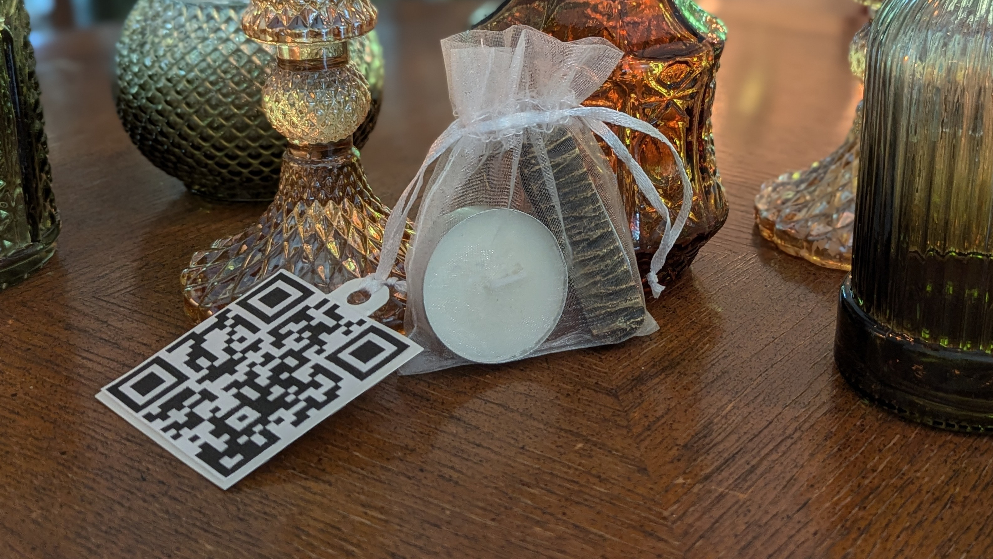 A QR Code printed and tied to a small gift bag