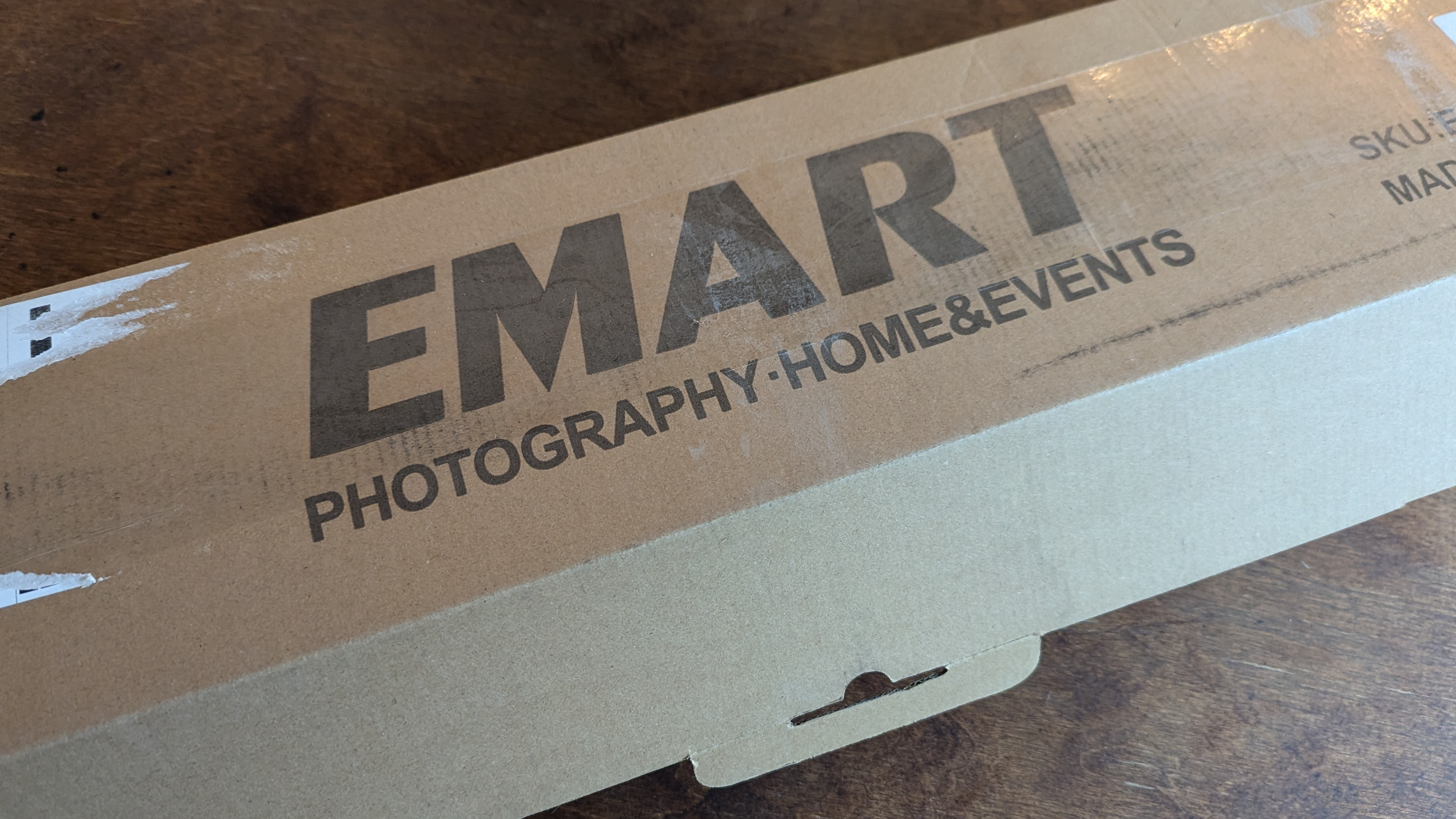 A box that just arrived with the frame for our wedding photo backdrop